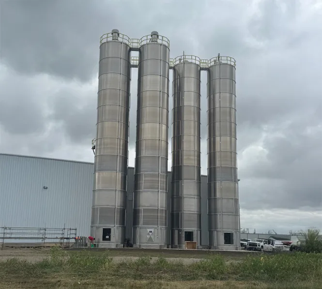 four large industrial silos